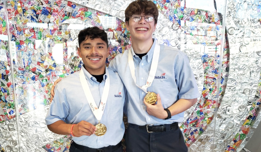 students posing with medals